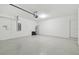 Spacious garage features sealed concrete floors for a clean and modern look at 11022 Moonsail Dr, Parrish, FL 34219
