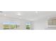 Bright living space with a large window and sliding glass doors to the backyard at 11022 Moonsail Dr, Parrish, FL 34219