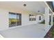 Covered patio with a sliding glass door offers seamless indoor-outdoor living at 11022 Moonsail Dr, Parrish, FL 34219