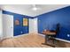 Bedroom with dark blue walls and laminate floors at 11368 93Rd St, Largo, FL 33773