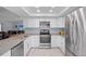 Bright kitchen features granite countertops and stainless steel appliances at 11368 93Rd St, Largo, FL 33773