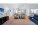 Open concept living room with light colored walls, high ceilings and wood floors at 11368 93Rd St, Largo, FL 33773