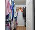 Organized walk-in closet with shelves, hanging rods, and ample storage space for clothing and accessories at 11368 93Rd St, Largo, FL 33773