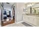Bathroom featuring granite counters, and a door leading to the bedroom and walk-in closet at 12525 Sparkleberry Rd, Tampa, FL 33626