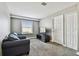 Bonus room or flexible space with cozy seating, natural light, and carpeting at 12525 Sparkleberry Rd, Tampa, FL 33626