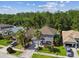 Two-story home with well-manicured lawn, mature trees, and a driveway in a quiet neighborhood at 12525 Sparkleberry Rd, Tampa, FL 33626