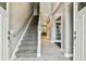 Welcoming foyer with tile flooring, staircase, and natural light creating a bright and airy entrance to the home at 12525 Sparkleberry Rd, Tampa, FL 33626