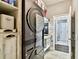 Convenient laundry area with modern washer/dryer and storage shelves at 12525 Sparkleberry Rd, Tampa, FL 33626