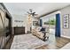 Comfortable living room featuring a ceiling fan, a sliding glass door to the pool area, and stylish decor at 12525 Sparkleberry Rd, Tampa, FL 33626