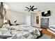 Spacious main bedroom features a ceiling fan, wood floors, and a large dresser at 12525 Sparkleberry Rd, Tampa, FL 33626