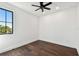 Bright bedroom with dark wood floors, a modern ceiling fan, and large windows for natural light at 1312 W Azeele St # 2, Tampa, FL 33606