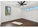 Bright bedroom with hardwood floors, large windows, and modern ceiling fan at 1312 W Azeele St # 2, Tampa, FL 33606