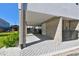 Carport with concrete block structure, patterned paving, and access to building entrance at 1312 W Azeele St # 2, Tampa, FL 33606