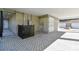 Carport showcasing block wall construction, door, exterior equipment and paved area at 1312 W Azeele St # 2, Tampa, FL 33606