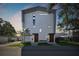 Modern exterior elevation with a clean design, contrasted by a well-manicured lawn at 1312 W Azeele St # 2, Tampa, FL 33606