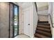Foyer with open staircase, large windows and unique concrete wall at 1312 W Azeele St # 2, Tampa, FL 33606