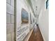 Hallway with original artwork and modern track lighting at 1312 W Azeele St # 2, Tampa, FL 33606