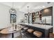 Modern kitchen features a large island with seating, stylish lighting, and stainless steel appliances at 1312 W Azeele St # 2, Tampa, FL 33606