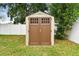 This backyard features a storage shed and grass at 1318 Crimson Clover Ln, Wesley Chapel, FL 33543