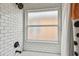 This bathroom features subway tile in the shower, as well as bronze fixtures and a frosted window at 1318 Crimson Clover Ln, Wesley Chapel, FL 33543