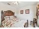 Bedroom with queen bed, ceiling fan and two chairs at 1318 Crimson Clover Ln, Wesley Chapel, FL 33543