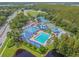 Aerial shot of the community showcasing the pool, water park, parking, and sports areas at 1318 Crimson Clover Ln, Wesley Chapel, FL 33543