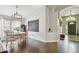 Cozy dining room with hardwood floors, a chalkboard, and a view into the hallway at 1318 Crimson Clover Ln, Wesley Chapel, FL 33543