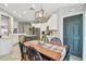 Bright kitchen with dining area featuring stainless steel appliances, and center island at 1318 Crimson Clover Ln, Wesley Chapel, FL 33543