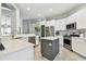 Bright, updated kitchen featuring white cabinetry, a center island, and stainless steel appliances at 1318 Crimson Clover Ln, Wesley Chapel, FL 33543