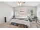 Bright bedroom featuring neutral walls, carpet floors, and dual desks for versatile use at 1318 Crimson Clover Ln, Wesley Chapel, FL 33543