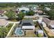 Aerial view of property featuring a pool, screened lanai, shed, and solar panels on the roof at 1601 14Th W St, Palmetto, FL 34221