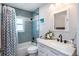 Bright bathroom with a tub and shower combo and updated vanity featuring ample countertop space at 1601 14Th W St, Palmetto, FL 34221