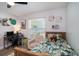 Well-lit bedroom with neutral tones, desk, a window and a wooden bed at 1601 14Th W St, Palmetto, FL 34221