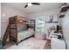 Cozy bedroom is furnished with bunk beds, a plush rug, and features a desk for studying at 1601 14Th W St, Palmetto, FL 34221