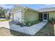Charming single-story home with a well-manicured lawn and attached two-car garage at 1601 14Th W St, Palmetto, FL 34221