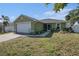 Charming one-story home featuring an attached garage and a well-maintained front yard at 1601 14Th W St, Palmetto, FL 34221