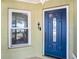 Stylish front door with decorative window, next to a window offering bright curb appeal at 1601 14Th W St, Palmetto, FL 34221
