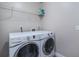 Well lit laundry room equipped with a modern washer and dryer at 1601 14Th W St, Palmetto, FL 34221
