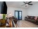 Inviting living room featuring wood floors, stylish furniture, and glass doors to the exterior at 1601 14Th W St, Palmetto, FL 34221