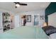 Bright main bedroom features an ensuite bathroom, walk-in closet, and decor shelving at 1601 14Th W St, Palmetto, FL 34221
