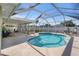 Inviting in-ground pool within a screened enclosure, perfect for relaxing and entertaining at 1601 14Th W St, Palmetto, FL 34221