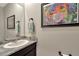 Well decorated bathroom with a stylish mirror, vanity, and modern granite countertop at 16633 Mooner Plank Cir, Wimauma, FL 33598