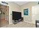 Small flex space decorated with Philadelphia Eagles memorabilia with access to hall at 16633 Mooner Plank Cir, Wimauma, FL 33598