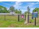 This dog park features a metal fence, a secure space for pets to play at 16633 Mooner Plank Cir, Wimauma, FL 33598