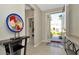 Bright entryway featuring neutral colors, decorative accents, and tile flooring with ample space and natural light at 16633 Mooner Plank Cir, Wimauma, FL 33598