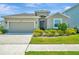 Charming single-Gathering home featuring a two-car garage and well-maintained landscaping at 16633 Mooner Plank Cir, Wimauma, FL 33598