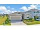 Well-manicured front exterior with neutral color palette, charming landscaping, and inviting curb appeal at 16633 Mooner Plank Cir, Wimauma, FL 33598