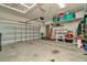 Spacious two car garage with overhead storage racks and ample room for parking at 16633 Mooner Plank Cir, Wimauma, FL 33598