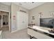 This office space is carpeted with neutral-colored walls and decorated with whimsical artwork at 16633 Mooner Plank Cir, Wimauma, FL 33598