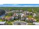Beautiful aerial view of a condo complex with a swimming pool and tropical landscaping at 2205 Belleair Rd # A24, Clearwater, FL 33764